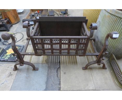 A Victorian cast iron fire grate and andirons 