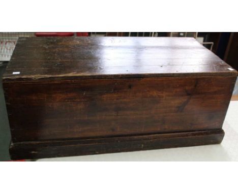 A probable 19th century stained pine trunk with twin handles