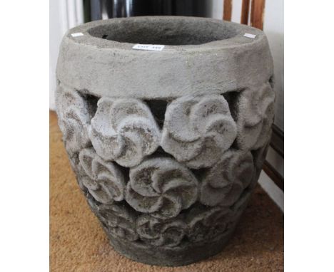 A stoneware garden planter with floral design