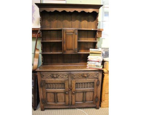 An Old Charm style dresser, two drawers over two cupboard doors, shelf rack &amp; cupboard top