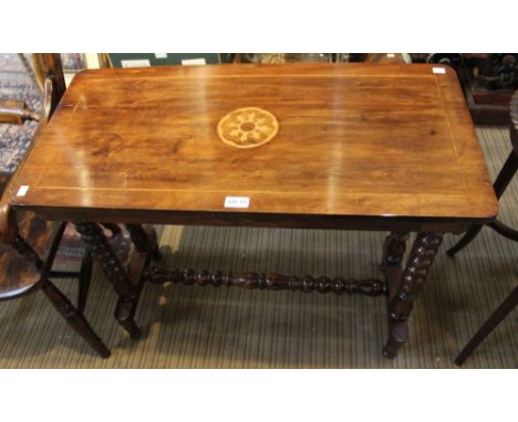 A 19th century mahogany side table with inlaid centre decoration on bobbin turned supports