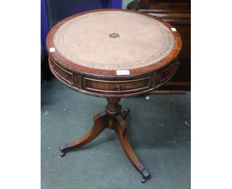 A reproduction circular drum table on tripod base with inset skiver top