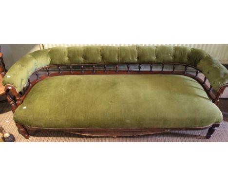 An Edwardian, low back sofa, upholstered in green fabric