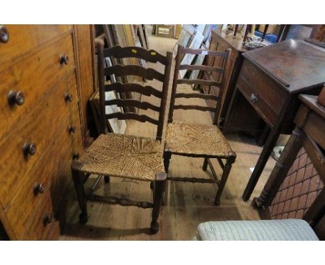 A PAIR OF LADDER BACK COUNTRY STYLE CHAIRS, WISH RUSH SEATS