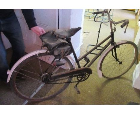A vintage push bicycle, possibly ARP, for decorative purposes only