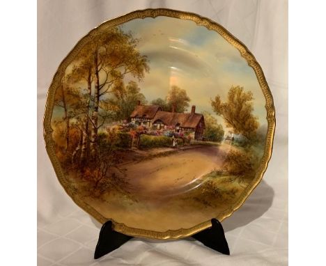 A Royal Worcester plate, decorated with a view of Anne Hathaway's cottage, by Raymond Rushton, circa 1941, diameter 10.75insC