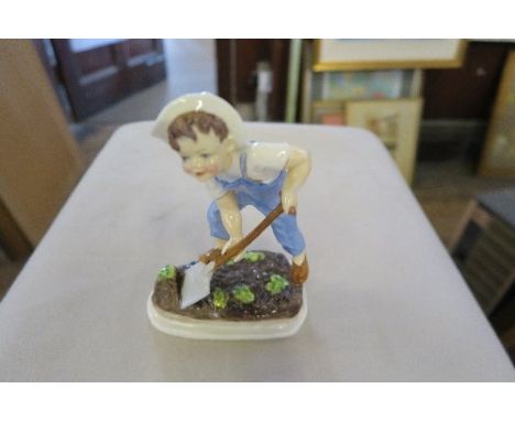 A ROYAL WORCESTER MODEL, SATURDAY'S CHILD, HEIGHT 7INS