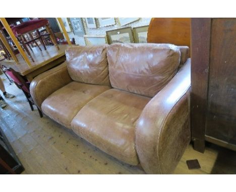 A LEATHER TWO SEATER SOFA with fire labels