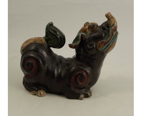 A stoneware model, of a dog of fo, length 8ins, height 7ins, afCondition Report:  Both tongue and tail are broken and re-stuc