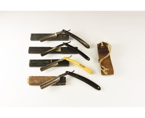 20th century AD. A mixed group of razors comprising: one in its case marked 'Gotta 120'; one similar, marked 'Emperor' to one