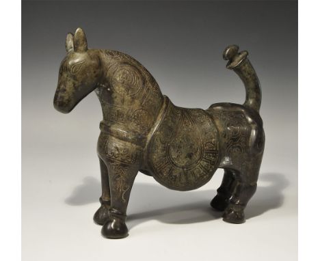 . An undated archaistic cast horse figurine with saddle-cloth and chest-band; the surface ornamented with bands of silver-inl