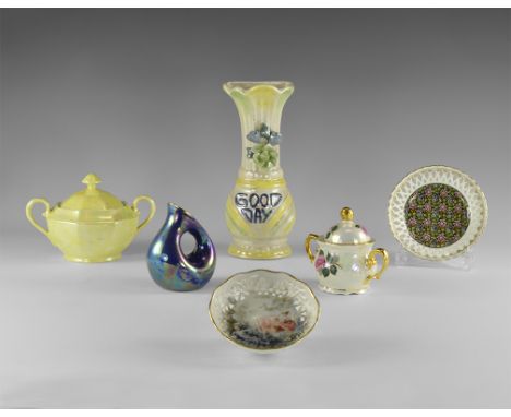 20th century AD. A mixed group of ceramic items with lustrous glaze comprising: a yellow sugar bowl with lid; a floral sugar 