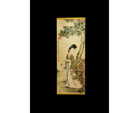 20th century AD. A rectangular paper panel on a paper backing with wooden roller, watercolour image of a robed lady with a fa