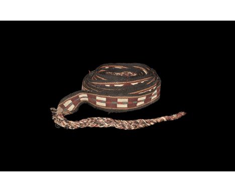 19th century AD. A tent band, flat woven with a geometric pattern of black, cream, blue, dark and light red colours with plai