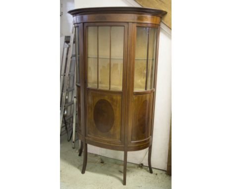 BOWFRONT DISPLAY CABINET, Edwardian mahogany and line inlaid with glazed and panel door enclosing a glass shelf, 180cm H x 10