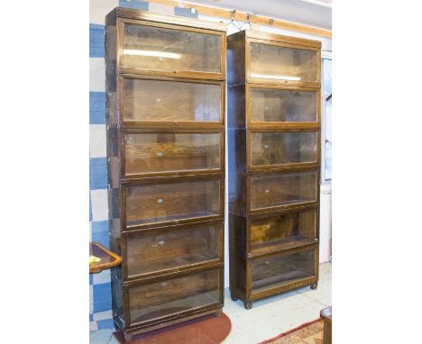 GLOBE WERNICKE BOOKCASES, a pair, mid 20th century oak, each six tier, one glass front missing, some paint marks, 86cm W x 28