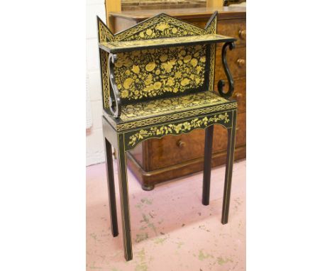 SIDE TABLE, antique gilt and ebonised penwork with pediment, shelf, scroll supports and stand, 122cm H x 65cm W x 23cm D.