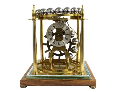 Geoffrey H. Bell &amp; Co Ltd spheroid weight clock, the 4.75" silvered chapter ring enclosing a skeletonised movement suppor