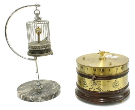 Contemporary novelty clock, the movement contained within a globe on an upright stand with horizontal chapter ring, over a si