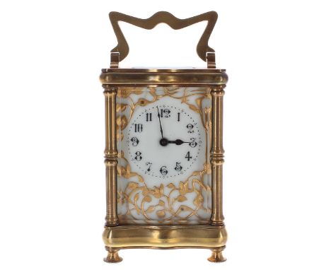 Attractive carriage clock timepiece, the cream dial within a gilt pierced foliate mask and douchine brass case, 6" high (key)