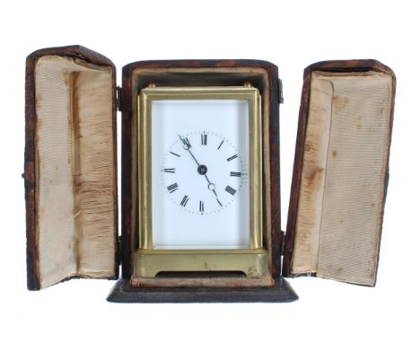 Carriage clock timepiece, within a gilded brass one piece style case, 5.75" high (winding key); also within an outer folding 