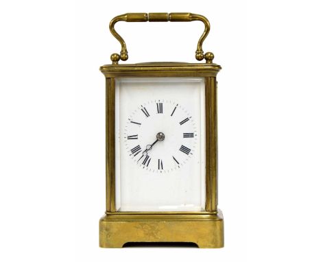 Carriage clock striking on a bell, within a corniche brass case, 6" high 