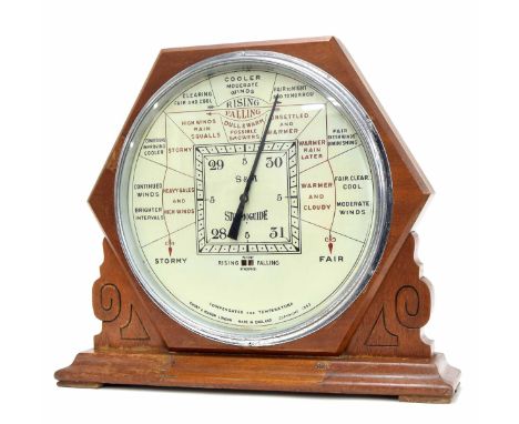 Short &amp; Mason of London storm guide table barometer, the 12" cream dial within a chrome bezel and scratch carved mahogany