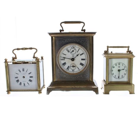 Seth Thomas carriage clock timepiece with alarm, striking on a bell fitted to the base, 7" high; also a small Waterbury carri