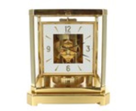 LeCoultre Atmos clock, the 4.75" square chapter ring within a brushed brass case, ser. no. 305259, 9.25" high