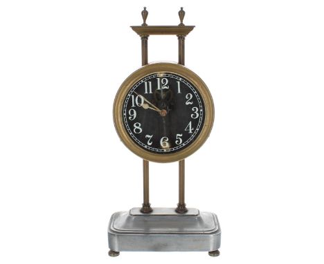 Small gravity clock, the 3" glass dial with visible escapement and pendulum, within a brass casing supported by two hexagonal
