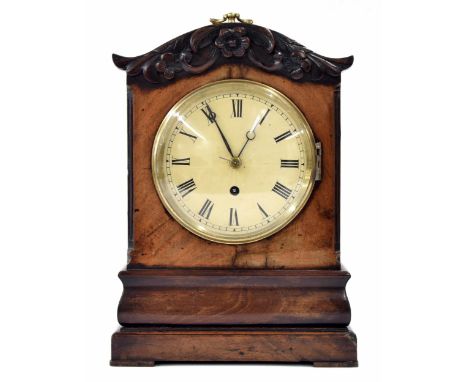 Small mahogany&nbsp;single fusee mantel clock, the 5.5" cream dial within a cushion stepped case surmounted by a foliate carv