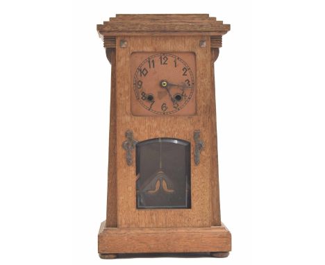 Oak Arts &amp; Crafts style two train mantel clock striking on a gong, the 3.5" square copper dial over a bevelled glazed pen