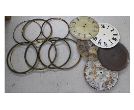 Quantity of circular longcase clock dials and chapter rings; also a quantity of old brass bezels etc 