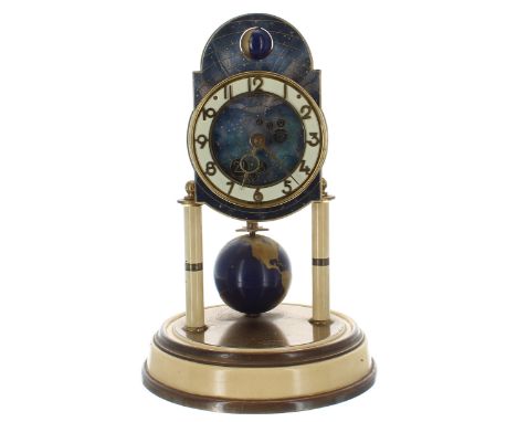 J. Kaiser world time torsion clock, the 3" white chapter ring enclosing a celestial centre surmounted by a rounded arched top