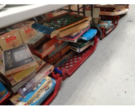 A large collection of vintage boxed games including two vintage bagatelles