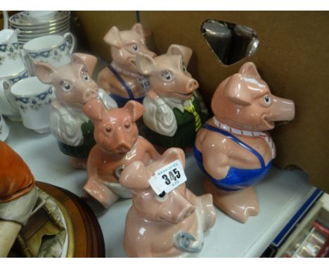 A collection of six Wade Natwest novelty piggies