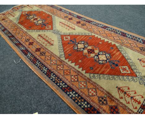 A Turkish woollen geometric patterned runner in blue &amp; orange ground, 2.24m long