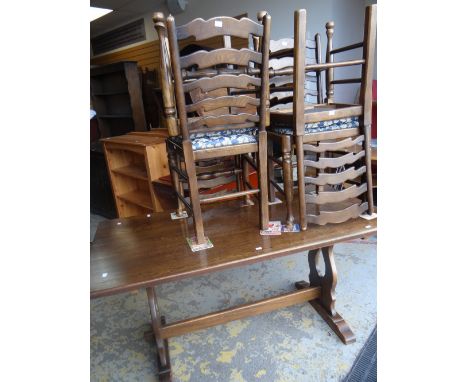A good reproduction Jaycee oak refectory table and four matching ladder back drop in cushion seated dining chairs