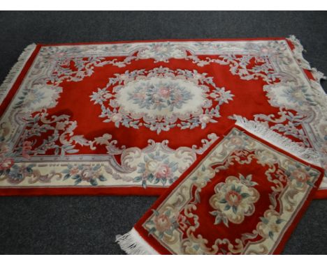 Red ground Chinese-style wash rug and similar runner, 255 x 168cms &amp; 95 x 60cms (2) 