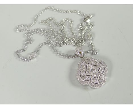 A modern 18ct white gold Art Deco style portrait locket set with tiny diamonds and on 18ct white gold fine necklace, 10gms Pl