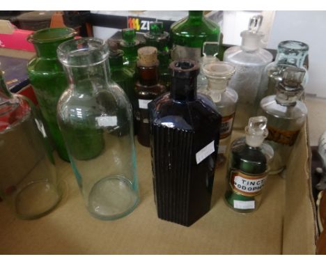 A collection of green and clear glass vintage pharmacy bottles ETC