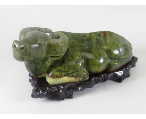 A modern sculptured jade figure of a cow with stand (boxed)