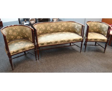 An antique / vintage three-piece floral upholstered antique tub-style suite comprising two armchairs and two-seater settee