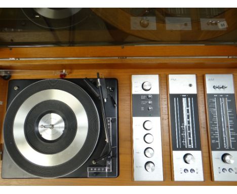 A retro standing Decasound compact 3 stereo system with record player and tuner