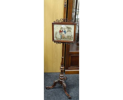 A Victorian pole screen with Berlin woolwork panel