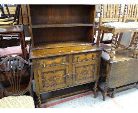 A vintage stained oak dresser having a cupboard base and open shelf top, 101cms wide