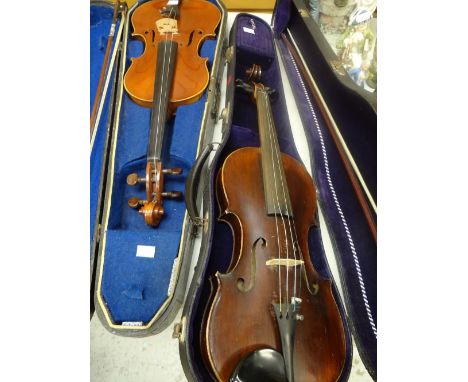 Two cased vintage violins