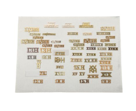 55 Cavalry shoulder titles, mostly brass, a few bronzed or anodised, of the 13th, 15th, 18th, 19th, 13/18th, and 15/19th Huss