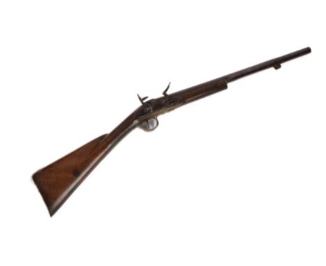 A late 18th century 14 bore flintlock sporting gun, 36" overall, barrel cut down to 21", flat lock with swan neck cock, raise