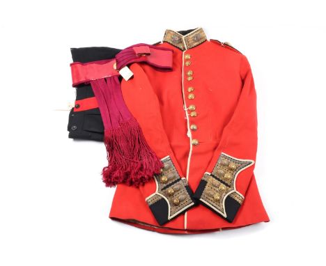 A post 1902 officer's uniform of the Coldstream Guards, comprising scarlet tunic with gilt regimental buttons, gilt bullion l